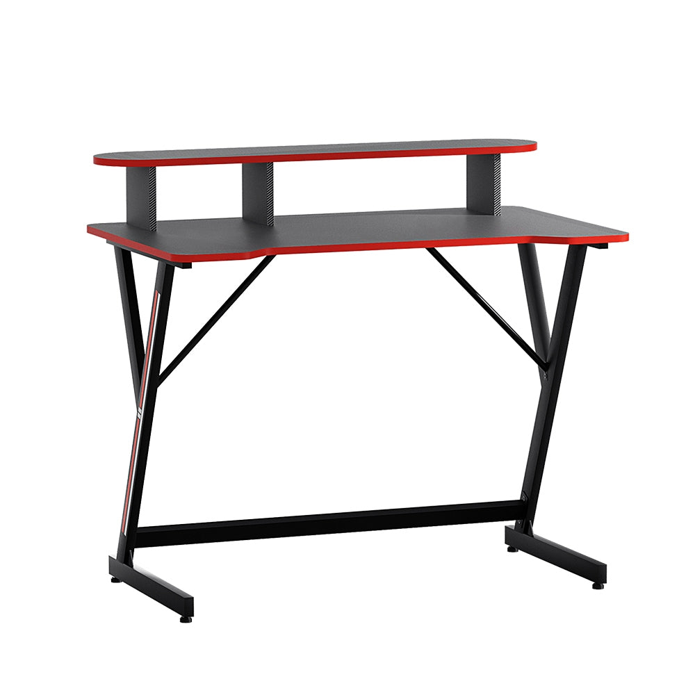Artiss 100cm gaming desk in black with red trim, raised monitor shelf and Z-frame steel legs, angled view