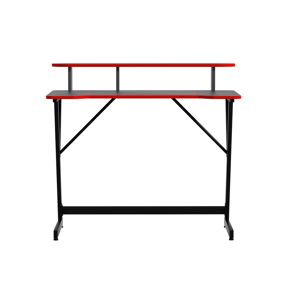Artiss 100cm gaming desk in black with red trim, front-on view showing monitor riser and Z-frame legs
