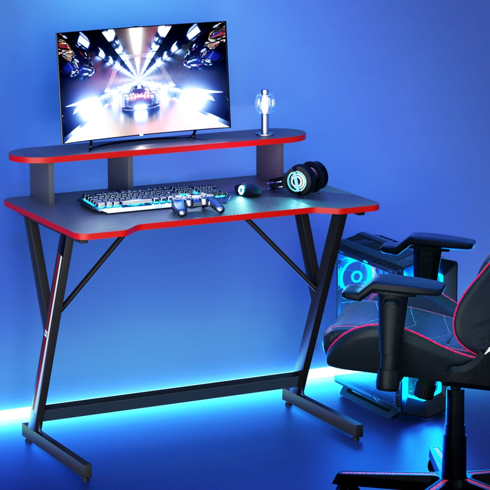 Artiss 100cm black gaming desk in lifestyle gaming room with monitor, PC tower and gaming chair