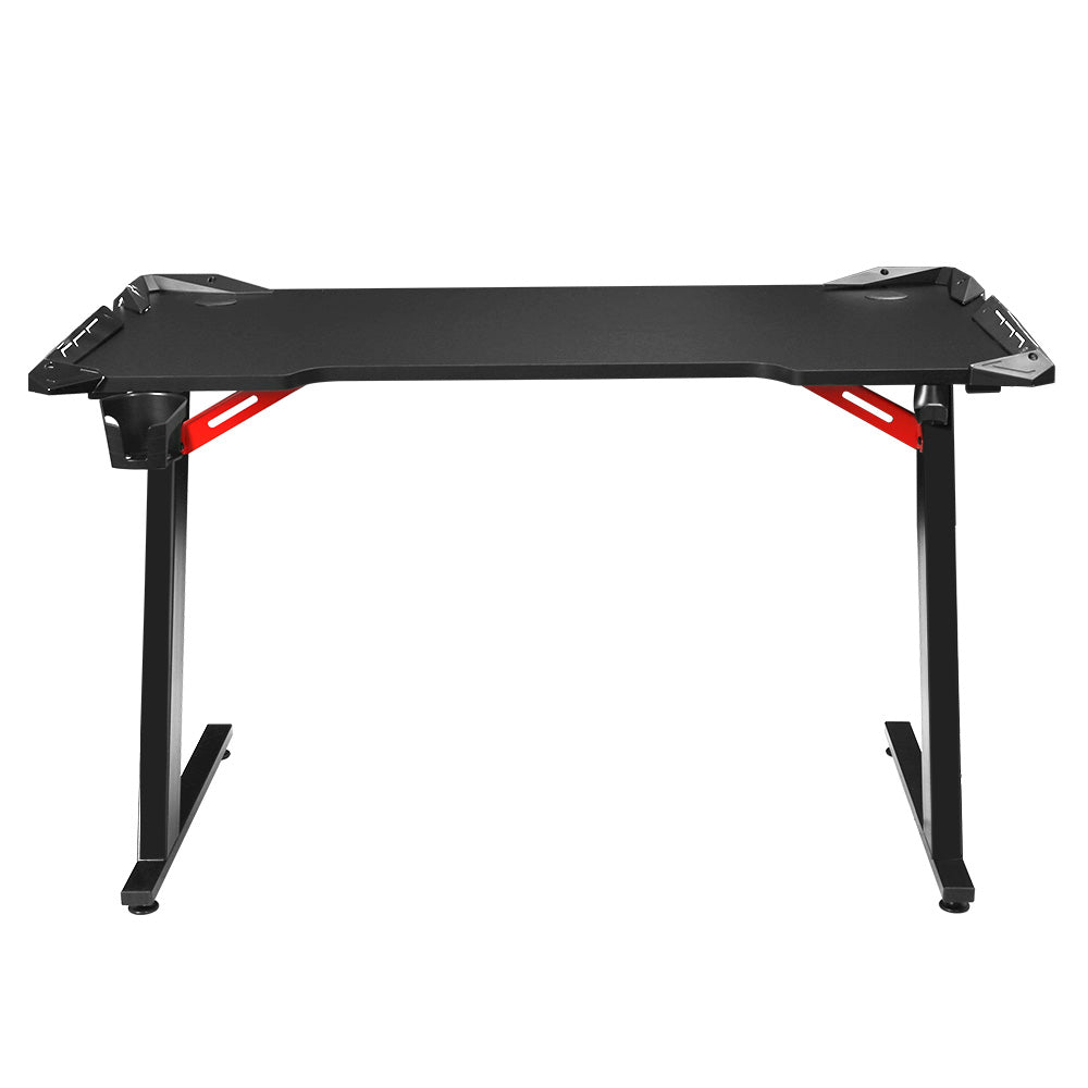 Artiss 120cm RGB gaming desk front-on view in black with curved desktop and red Z-frame supports