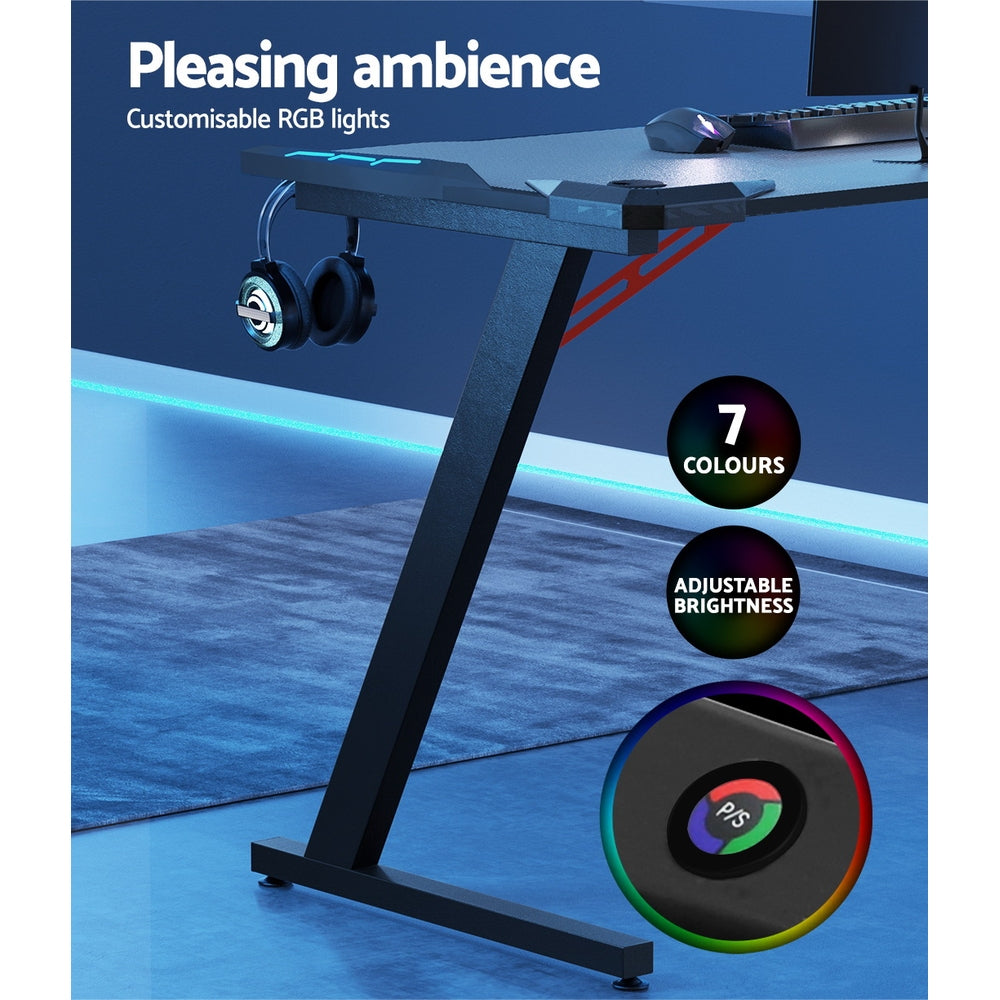 Artiss 120cm RGB gaming desk callout showing 7 colour RGB lights with adjustable brightness and remote