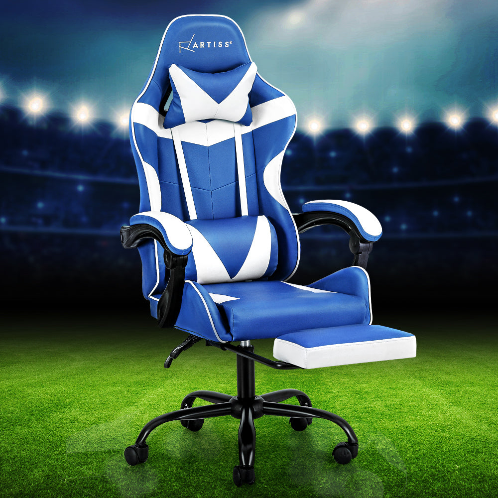 Artiss blue and white gaming chair with footrest staged on a green football pitch stadium background