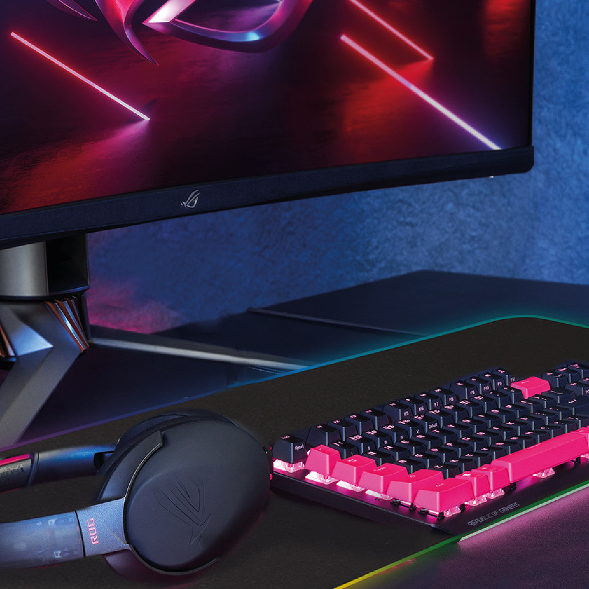 Laser extra-large RGB gaming mouse pad with a mechanical keyboard and headset in a desk setup
