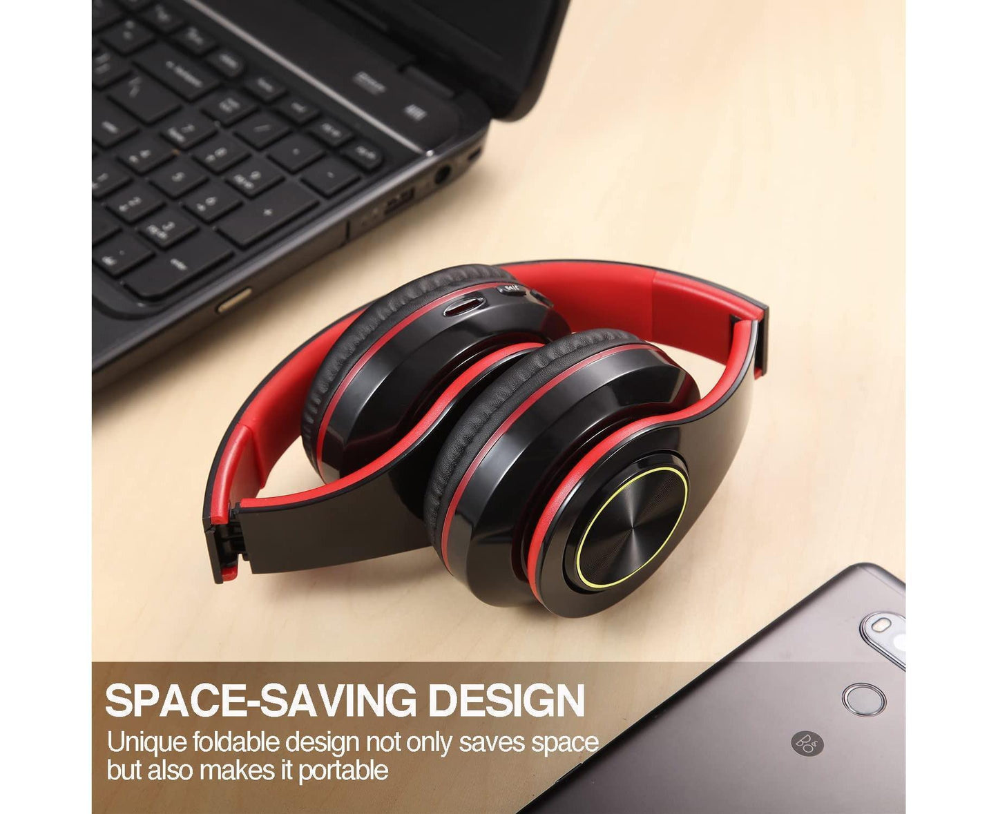JX-992 headphones shown folded next to laptop and phone on a desk to show portable carry size