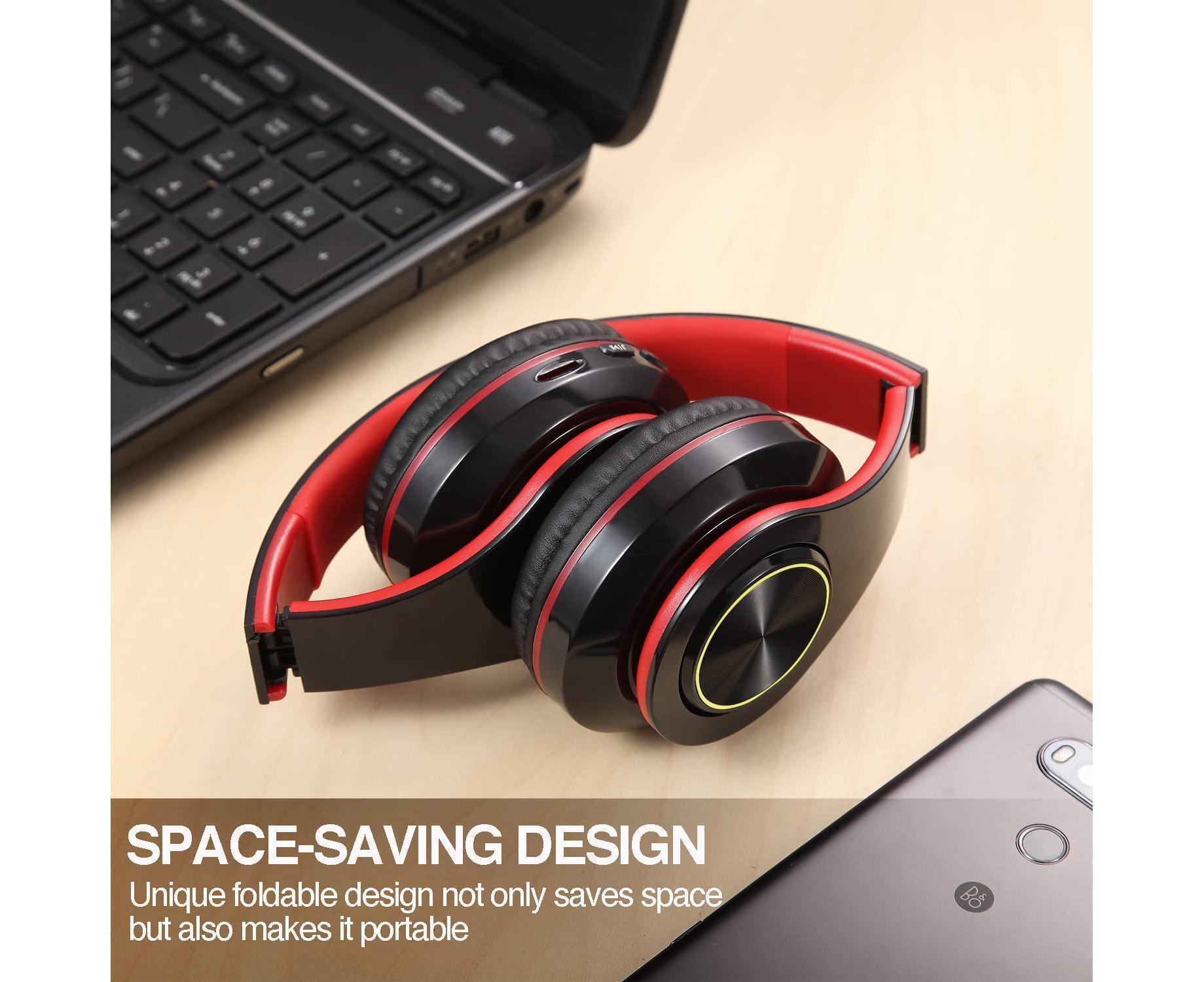 JX-992 headphones shown folded next to laptop and phone on a desk to show portable carry size